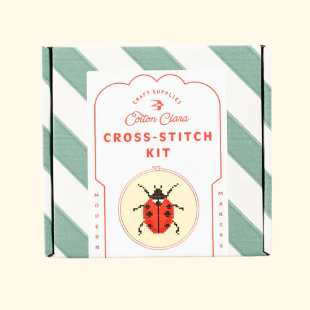 Cotton Clara Ladybird Cross Stitch Kit in striped gift box packaging.