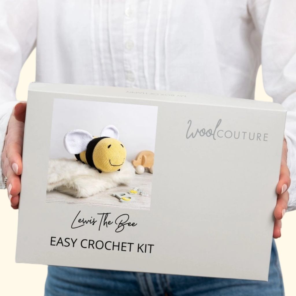 Gift box packaging for the Wool Couture Lewis The Bee Crochet Kit featuring the finished bee design.