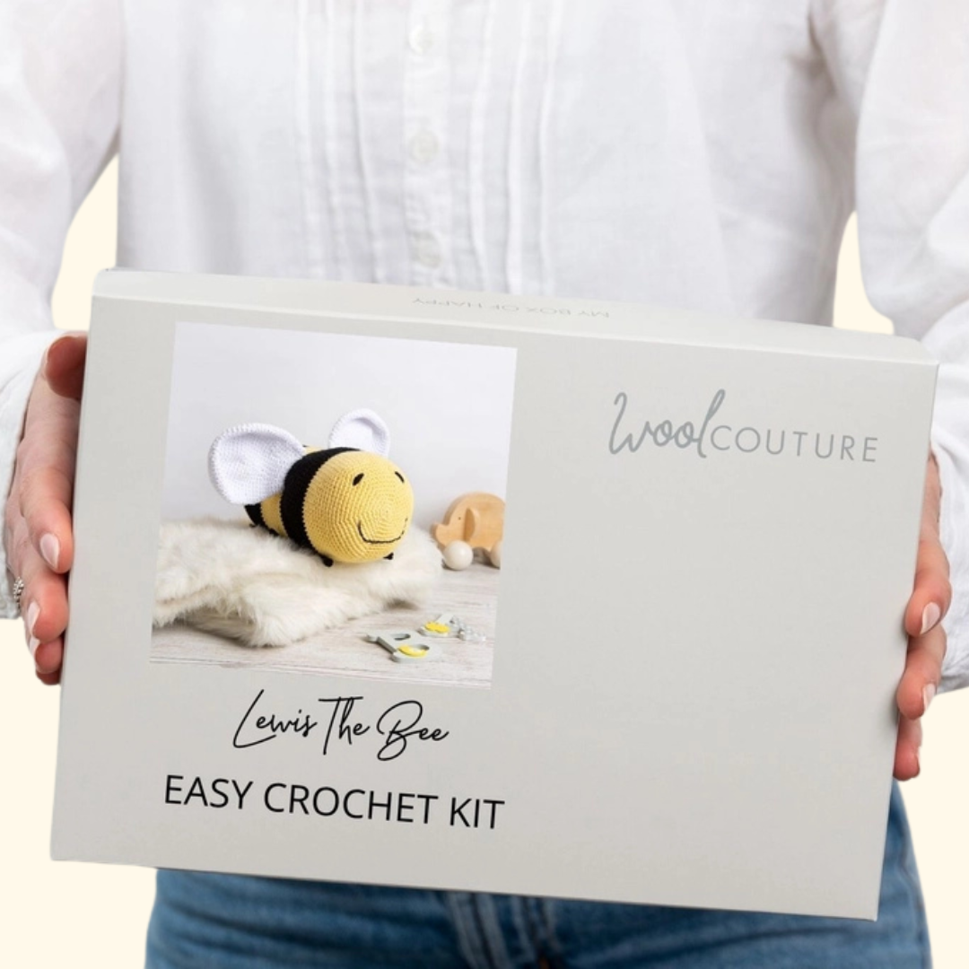 Gift box packaging for the Wool Couture Lewis The Bee Crochet Kit featuring the finished bee design.