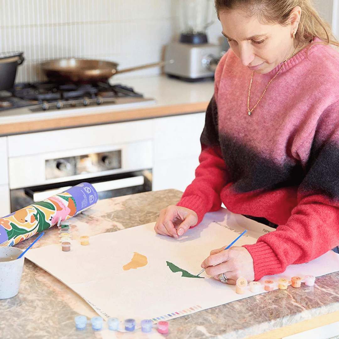 Painting the Life Is Beautiful Paint By Numbers Kit by Journey of Something on the pre-printed canvas.