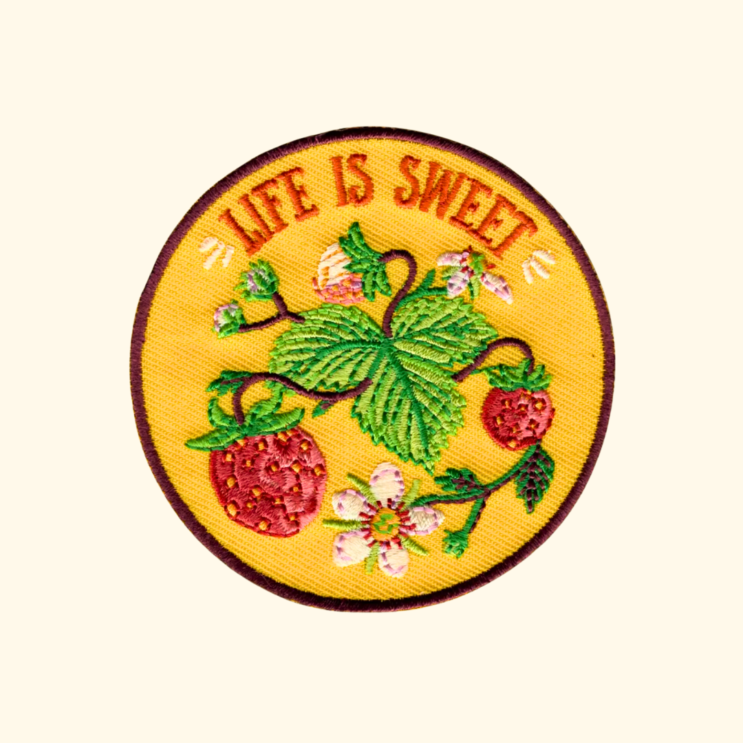 Life Is Sweet embroidered iron on patch by Anna Seed Art featuring strawberries, flowers and the words "Life Is Sweet".
