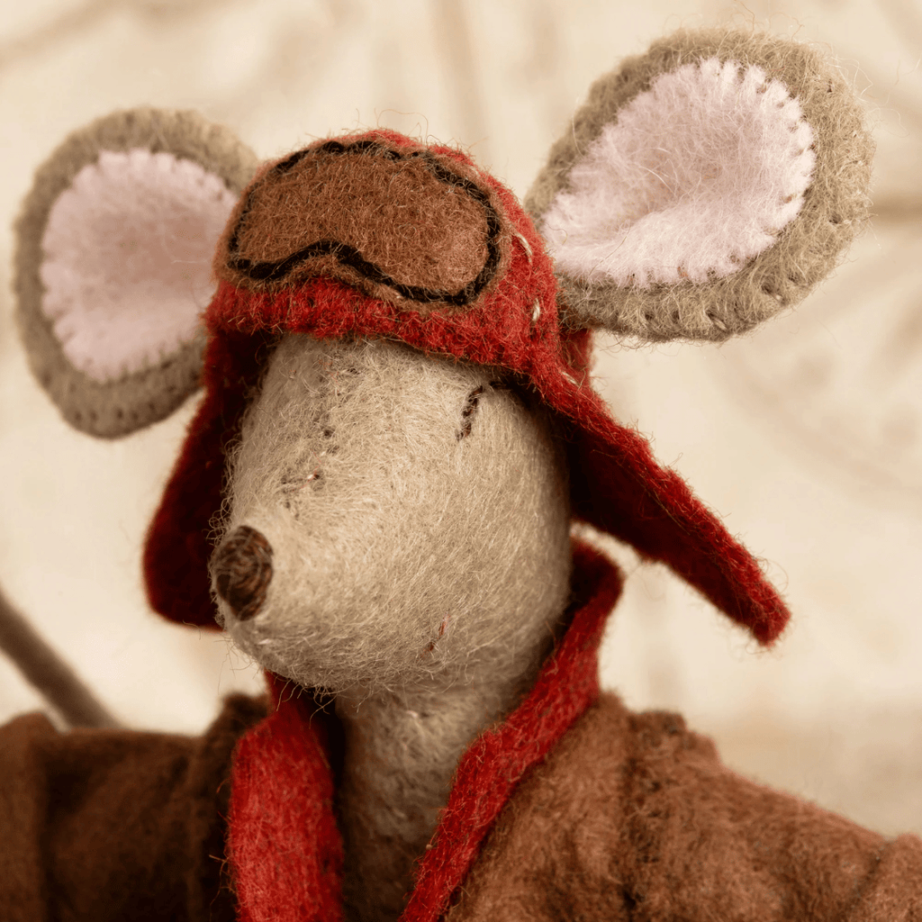 Close-up of the Little Mouse Aviator felt mouse wearing a vintage red aviator helmet with oversized felt ears.