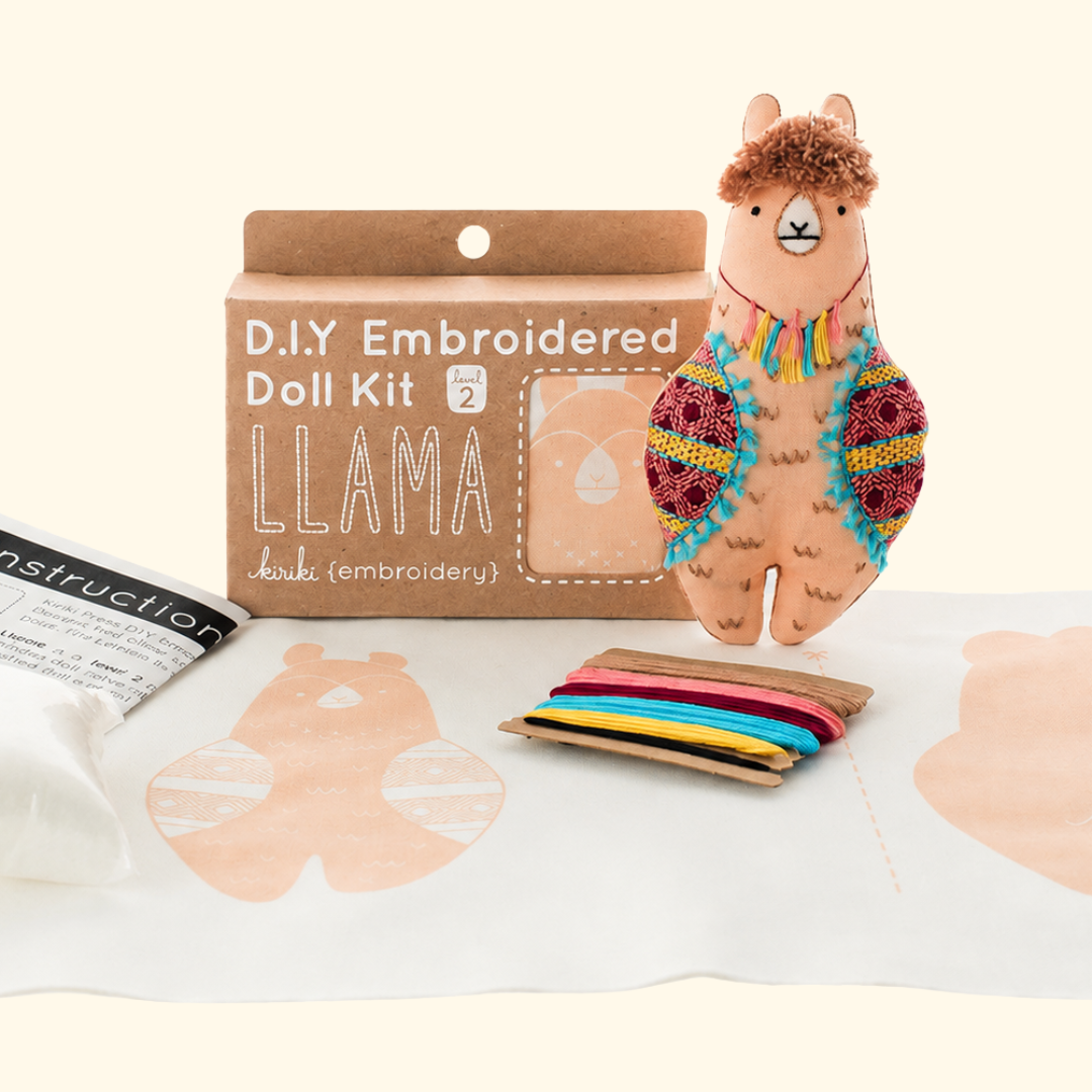 Llama Embroidery Kit contents including printed fabric, embroidery floss, hoop and instructions.
