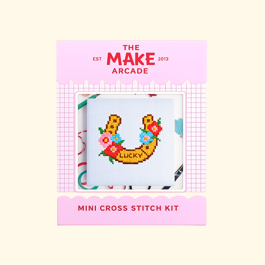 Lucky Horseshoe Mini Cross Stitch Kit packaging by The Make Arcade showing the finished horseshoe design.