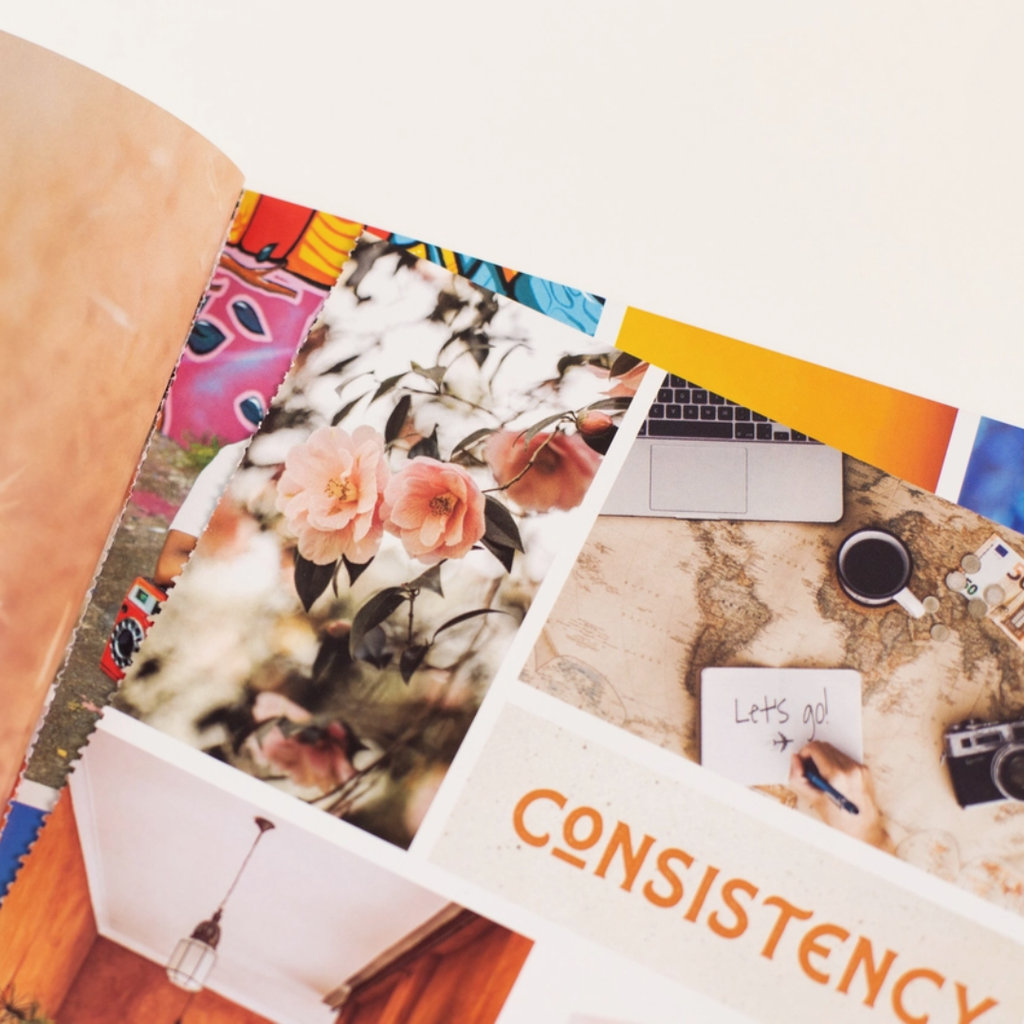 Close up of a vision board featuring curated images, affirmations and goal setting themes