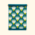 Completed bargello wall hanging featuring a teal, aqua and lime scallop pattern displayed in a wooden frame