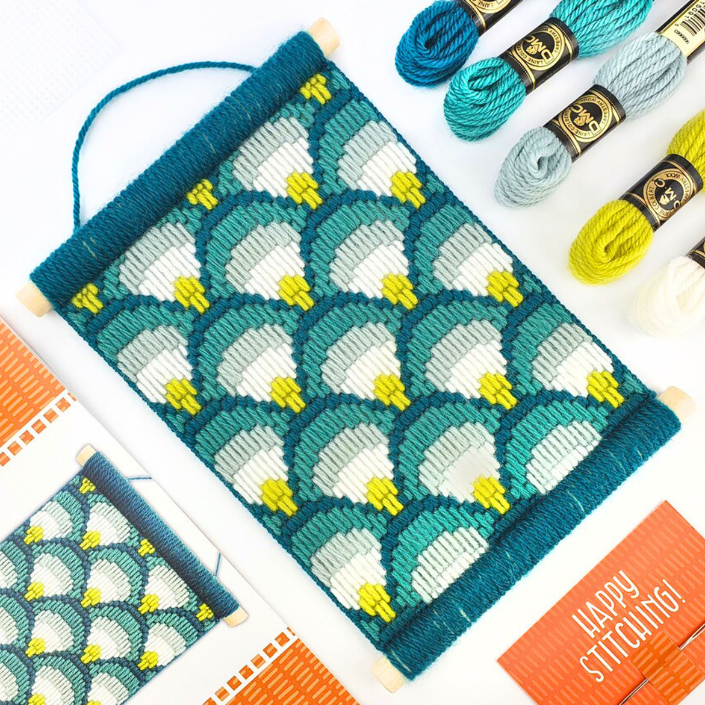 Making Waves Bargello Wall Hanging Kit displayed in a crafting workspace with threads and embroidery supplies