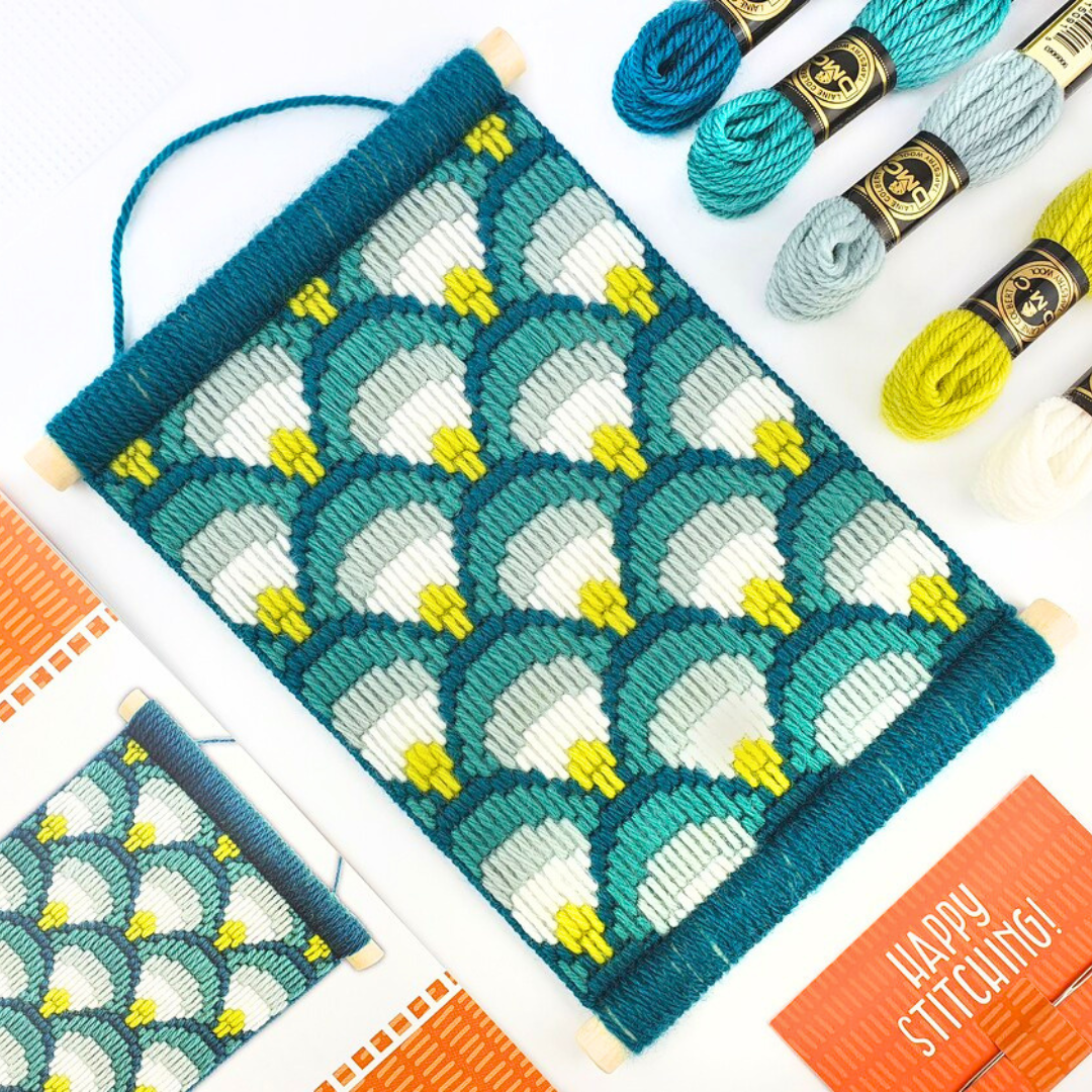 Making Waves Bargello Wall Hanging Kit displayed in a crafting workspace with threads and embroidery supplies