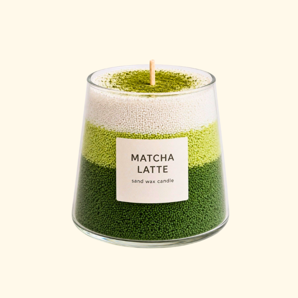 Alt text: Finished matcha latte sand candle made with the Aurea Nova candle making kit, featuring layered green and white sand wax.