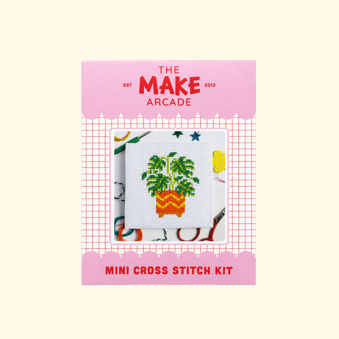 The Make Arcade Monstera Mini Cross Stitch Kit in pink recyclable packaging.