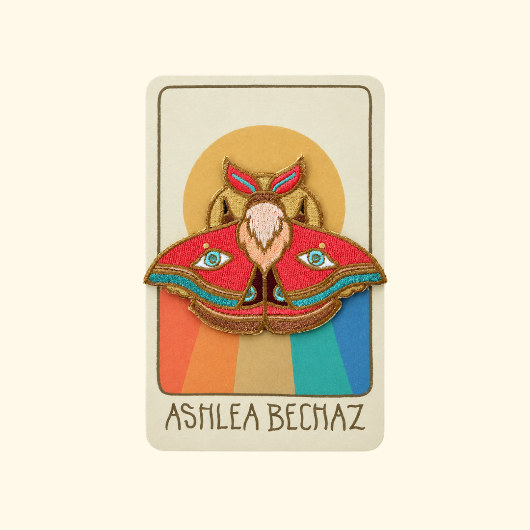 Moth Embroidered Iron On Patch by Ashlea Bechaz Illustration displayed on illustrated backing card against a cream background.