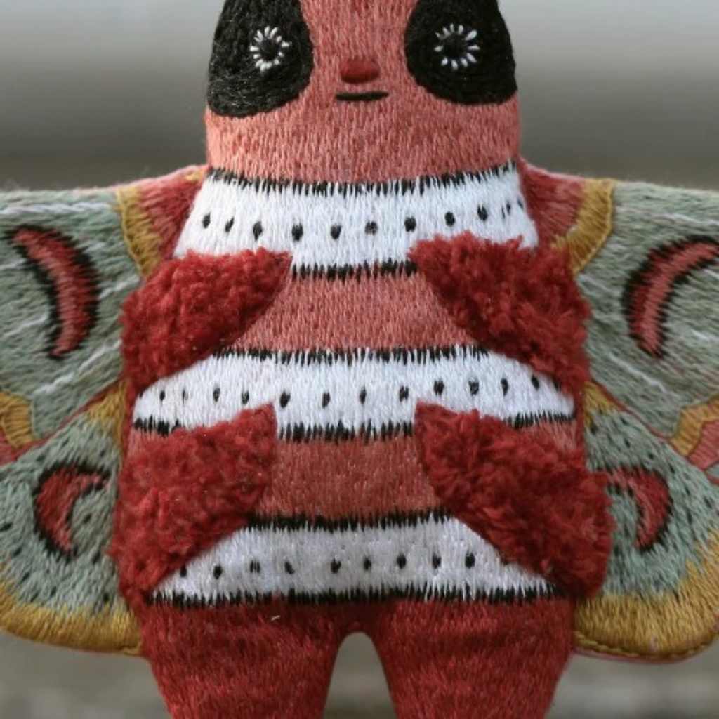 Detailed embroidery on the finished moth embroidery kit