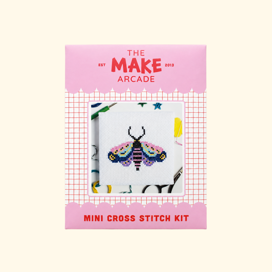 The Make Arcade Moth Mini Cross Stitch Kit in pink recyclable packaging.