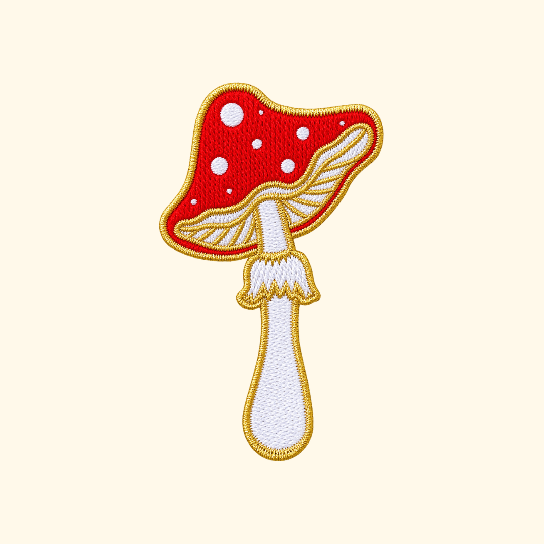 Red and white spotted mushroom embroidered iron on patch designed by Melbourne artist Missy Minzy.