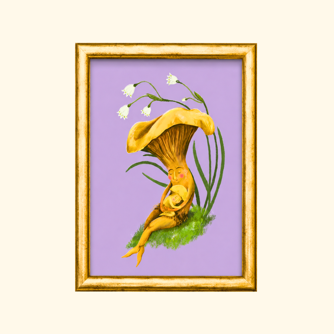 Mushroom Snuggles greeting card displayed in a gold frame, showcasing a charming illustration of a mother mushroom embracing her baby on a soft lavender background.