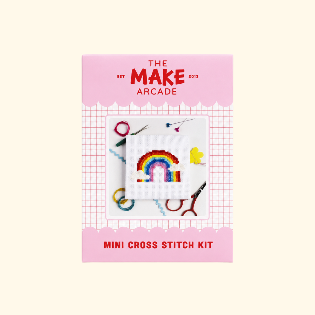 Over The Rainbow Mini Cross Stitch Kit packaging by The Make Arcade showing the finished rainbow design.
