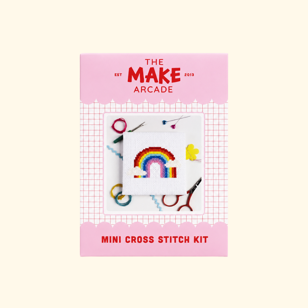 Over The Rainbow Mini Cross Stitch Kit packaging by The Make Arcade showing the finished rainbow design.