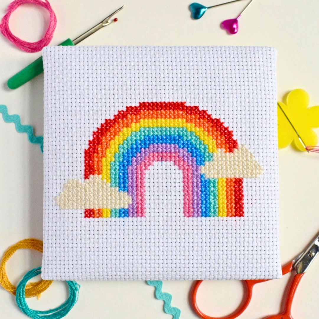 Over The Rainbow Mini Cross Stitch Kit in progress stitched on white Aida fabric.