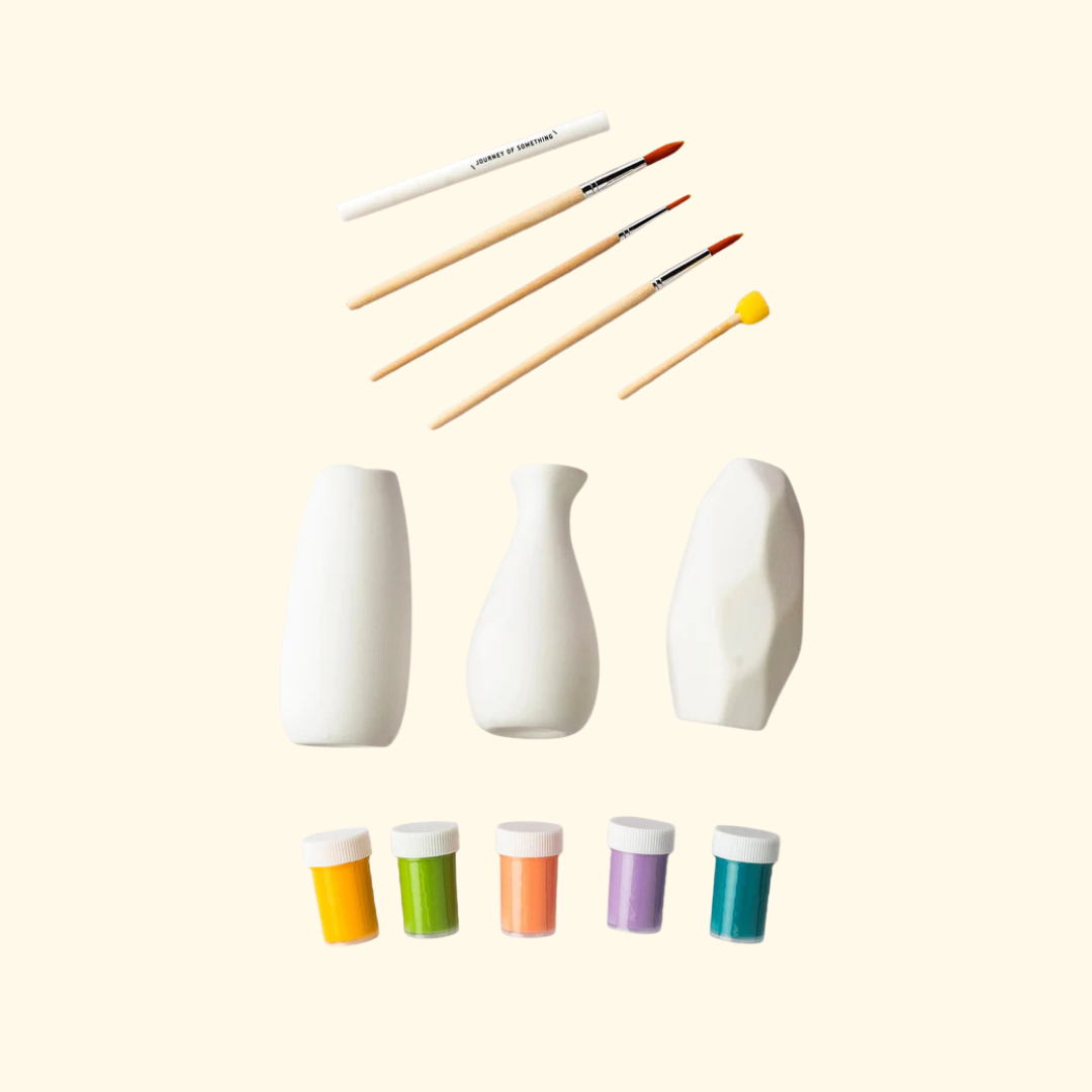 Paint Your Own Vases Kit contents including ceramic vases, paint brushes and paint pots.