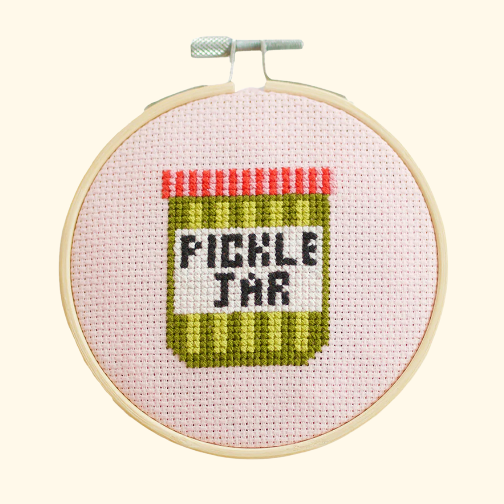 Completed pickle jar cross stitch design stitched in a bamboo embroidery hoop by Cotton Clara.