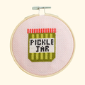 Completed pickle jar cross stitch design stitched in a bamboo embroidery hoop by Cotton Clara.