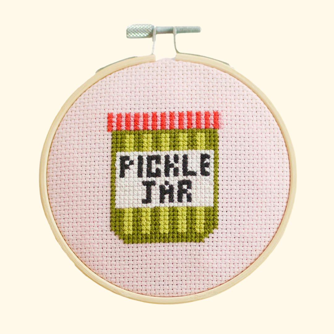 Completed pickle jar cross stitch design stitched in a bamboo embroidery hoop by Cotton Clara.