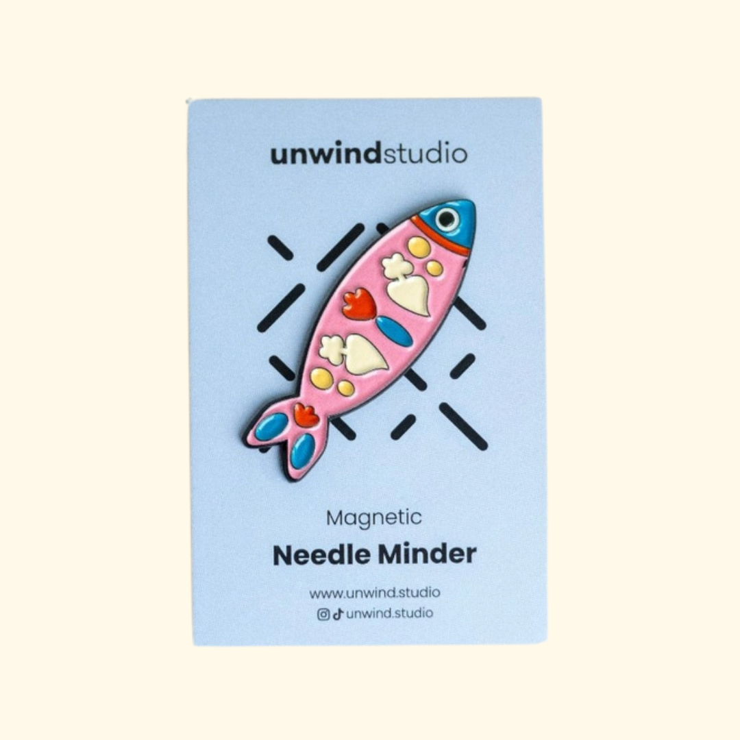 Portuguese Sardine Magnetic Needle Minder by Unwind Studio displayed on its blue packaging card.