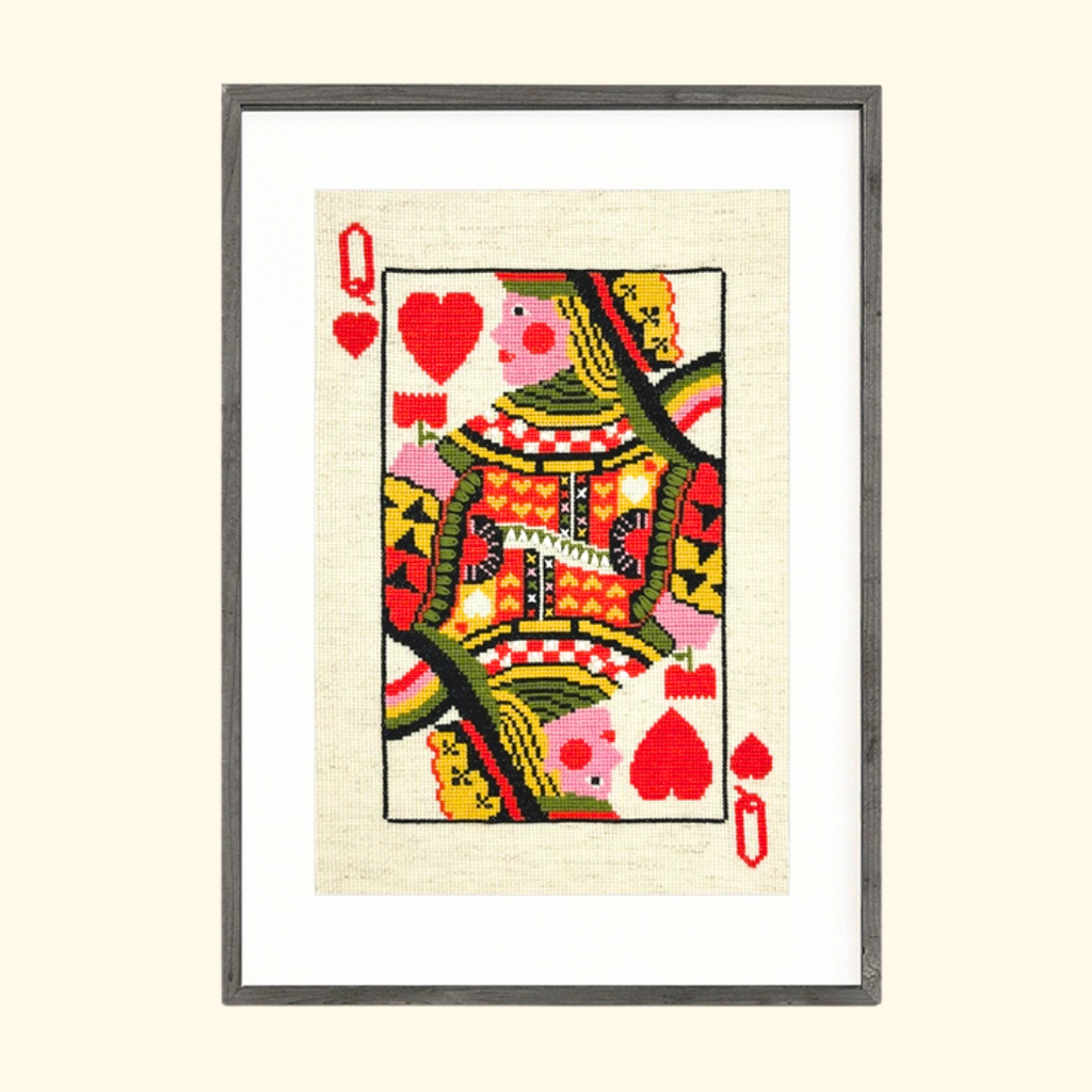Queen of Hearts Cross Stitch Kit by Budgiegoods, completed playing card design framed in black.
