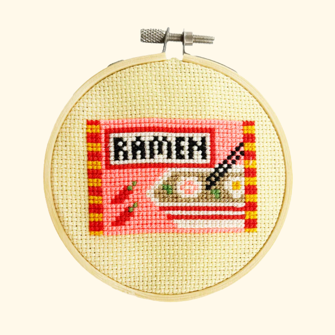Completed ramen cross stitch design stitched in a bamboo embroidery hoop by Cotton Clara.