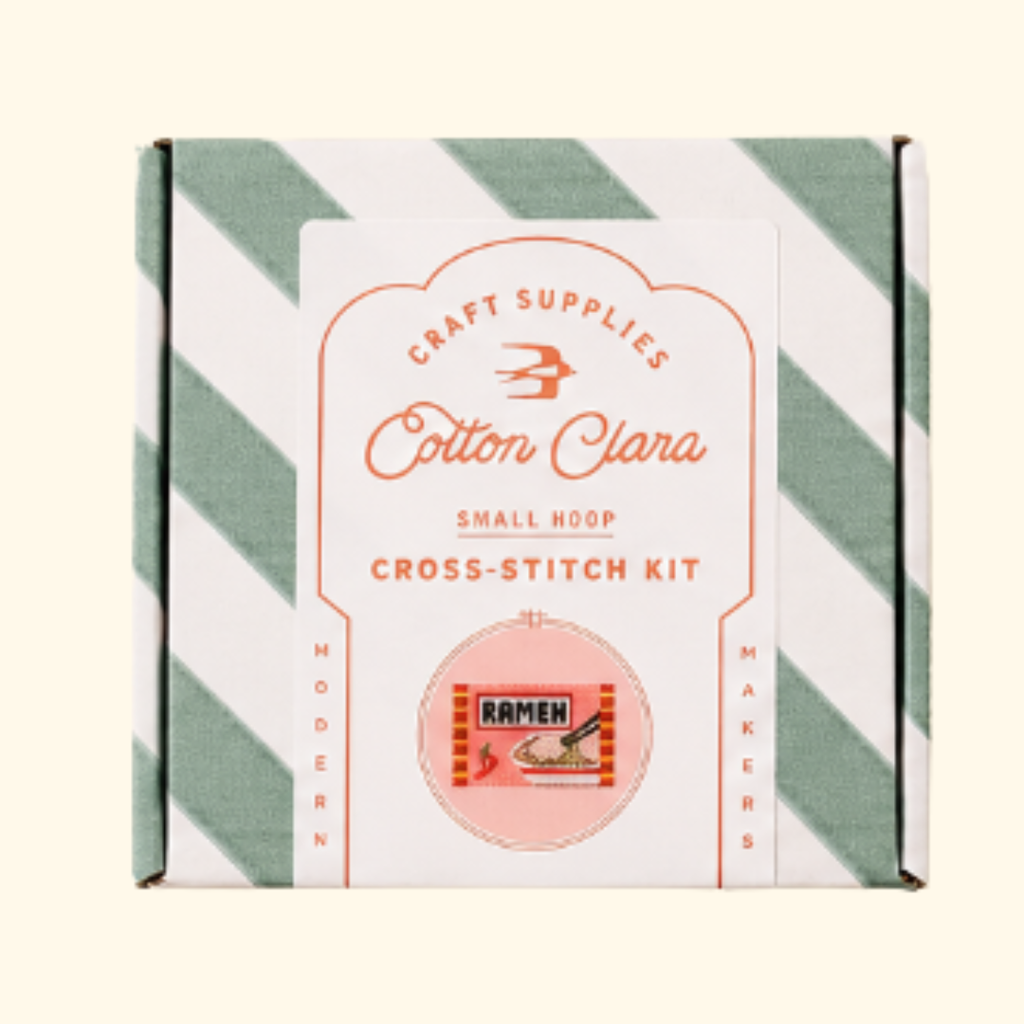 Cotton Clara Ramen Cross Stitch Kit in striped gift box packaging.