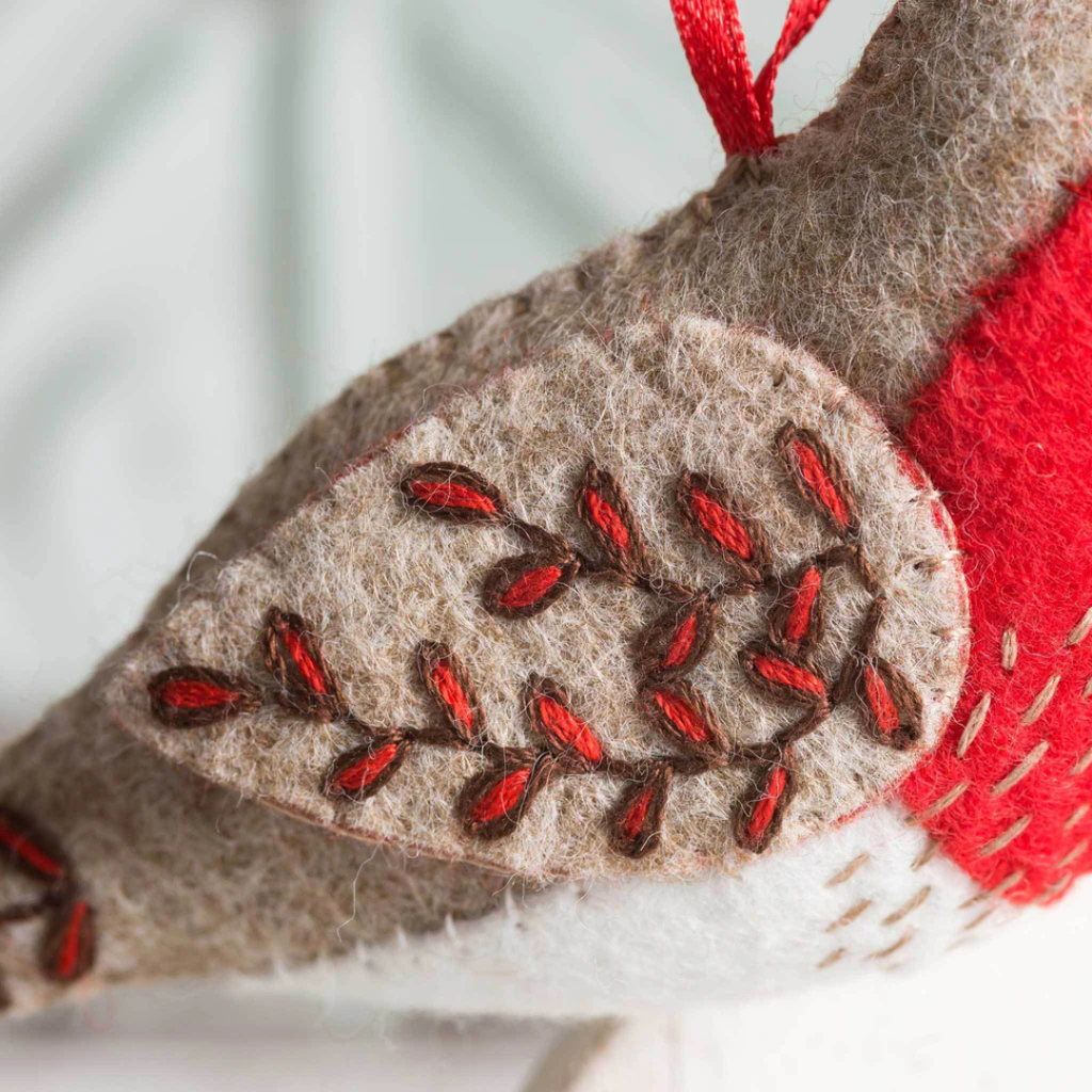 Close up of embroidered stitching details on the Red Robin felt craft kit by Corinne Lapierre.