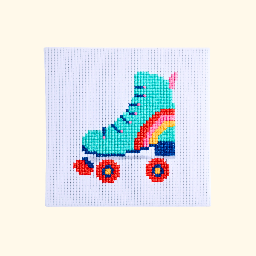 Completed Roller Derby Mini Cross Stitch Kit featuring a colourful roller skate design by The Make Arcade.