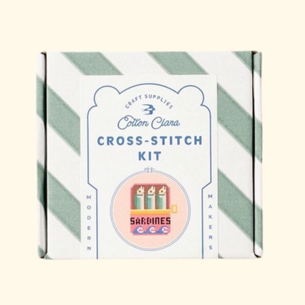 Cotton Clara Sardines Cross Stitch Kit in striped gift box packaging.