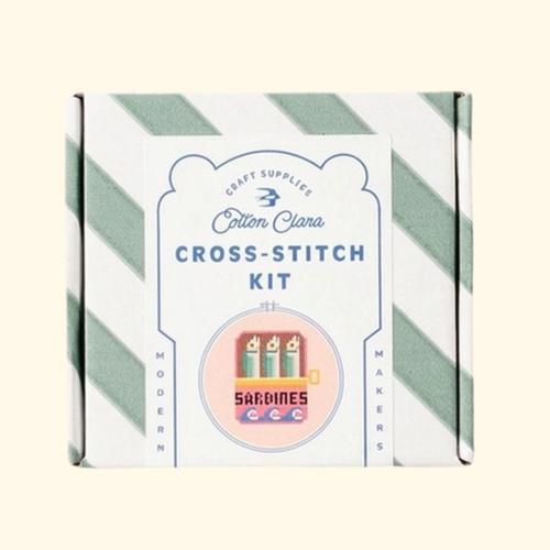 Cotton Clara Sardines Cross Stitch Kit in striped gift box packaging.