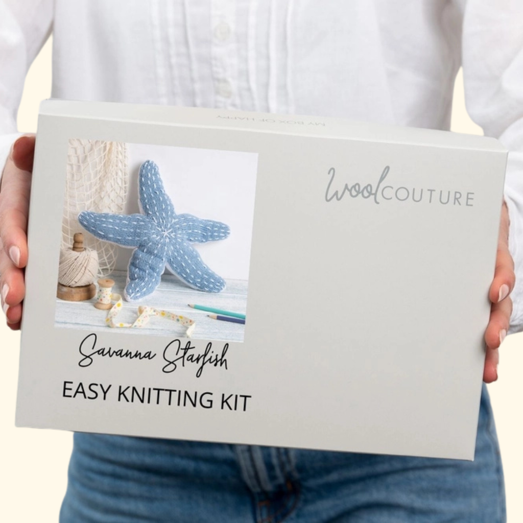 Gift box packaging for the Wool Couture Savanna Starfish Knitting Kit featuring the finished starfish design.