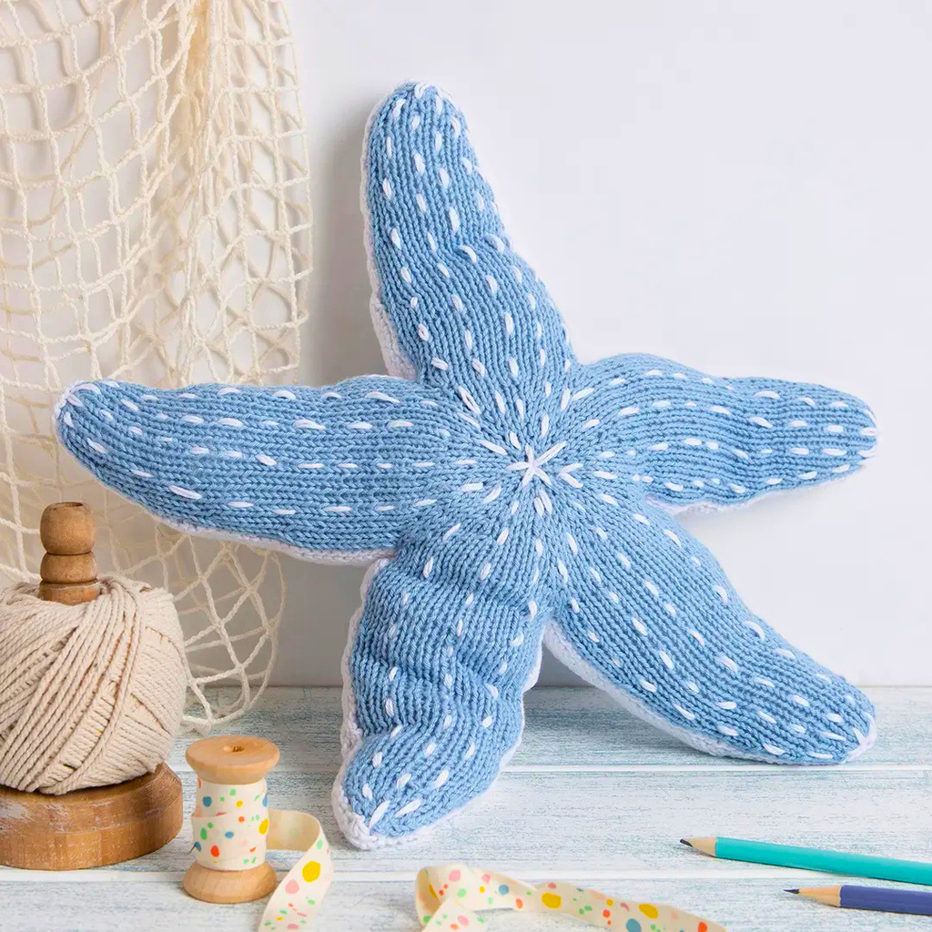 Completed Savanna Starfish knitted toy displayed as coastal inspired home décor.