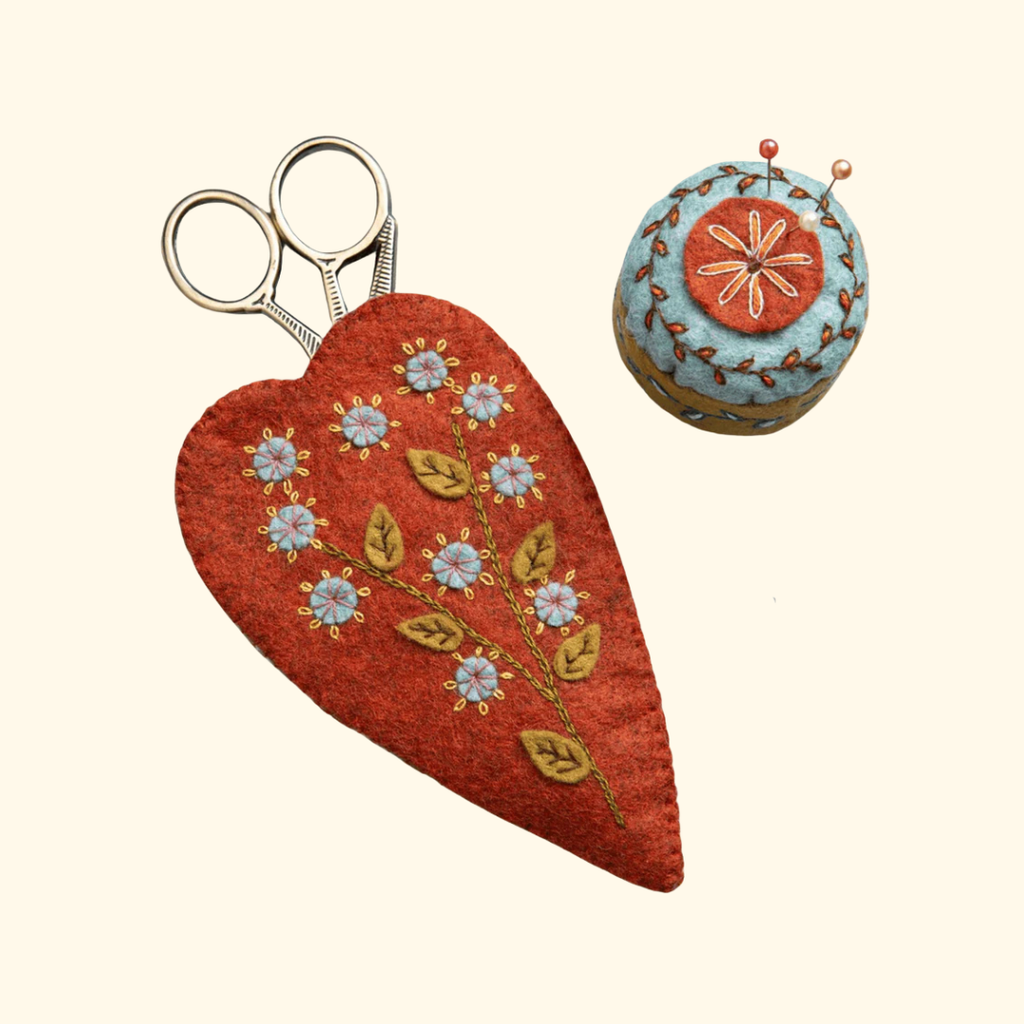 Embroidered felt scissors pouch with floral stitching and matching pincushion by Corinne Lapierre