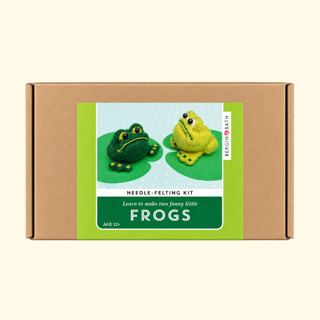 Bergin And Bath Set Of 2 Frogs Needle Felting Kit in kraft cardboard packaging with a green illustrated label featuring two cheerful wool frogs.