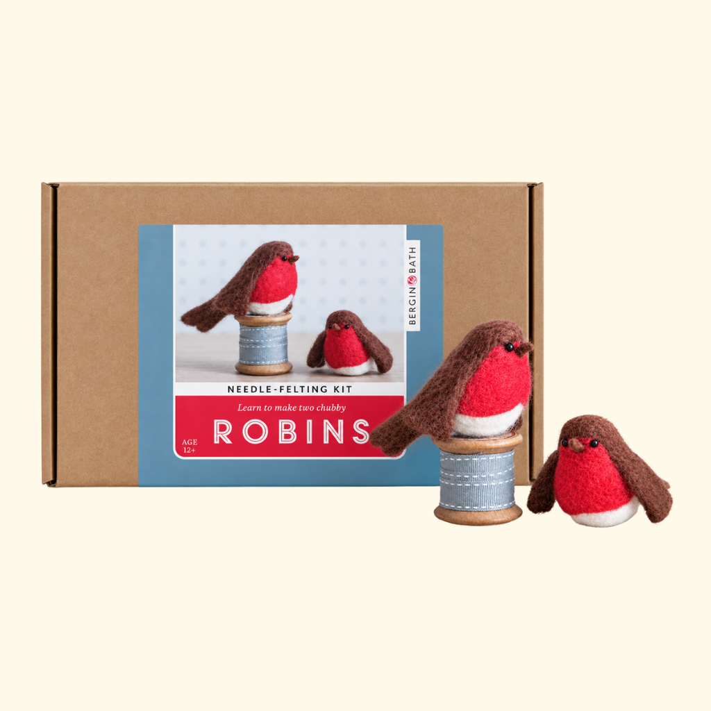 Bergin And Bath Set Of 2 Robins Needle Felting Kit packaging displayed alongside two finished wool robins with red breasts and brown feathers.