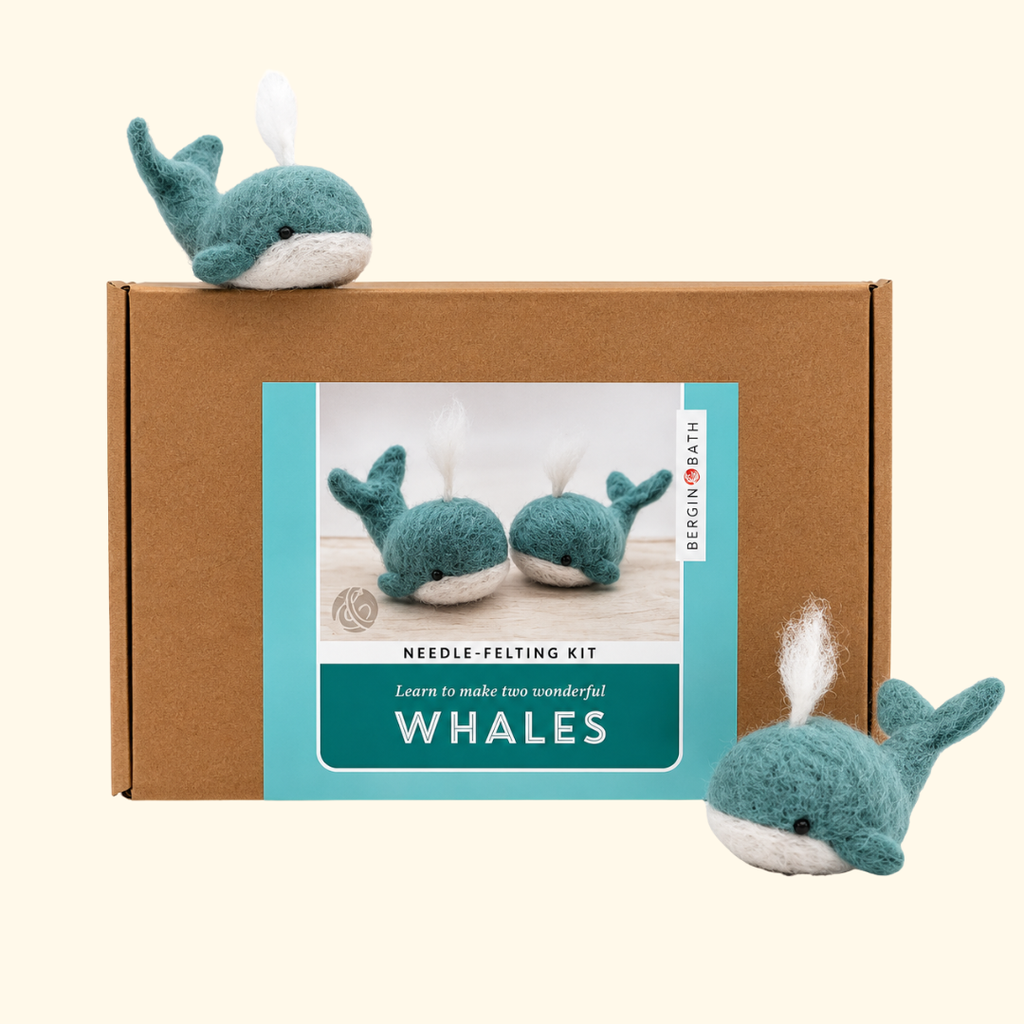 Bergin And Bath Set Of 2 Whales Needle Felting Kit displayed with two finished blue wool whales and illustrated kit packaging.