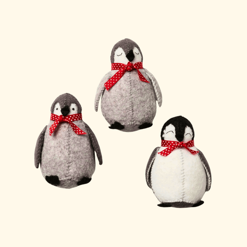 Completed Set of 3 Penguin Felt Craft Kit featuring three handmade felt penguins with red scarves.
