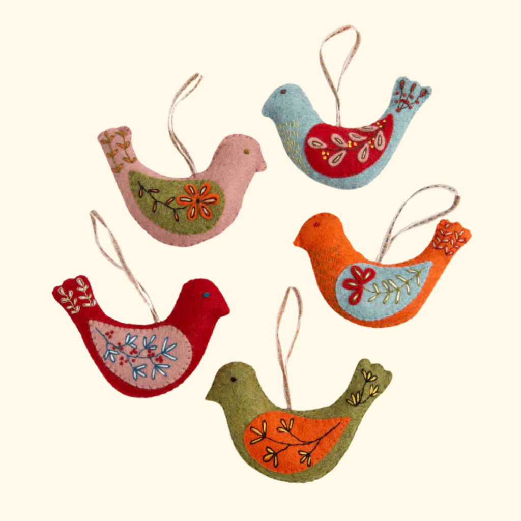 Five completed felt bird ornaments from the Set Of 5 Folk Birds Felt Craft Kit by Corinne Lapierre displayed against a neutral background.