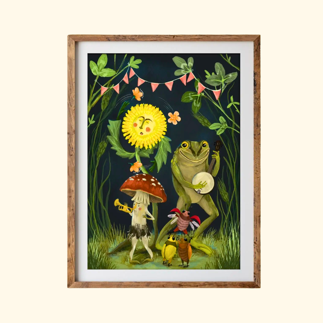 Showtime A4 art print by Anna Seed Art displayed in a timber frame, featuring whimsical mushroom characters, flowers, insects and botanical details.