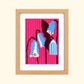 Finished Silky Leather Needlepoint Kit by Unwind Studio featuring a colourful fashion portrait in pink, blue and black