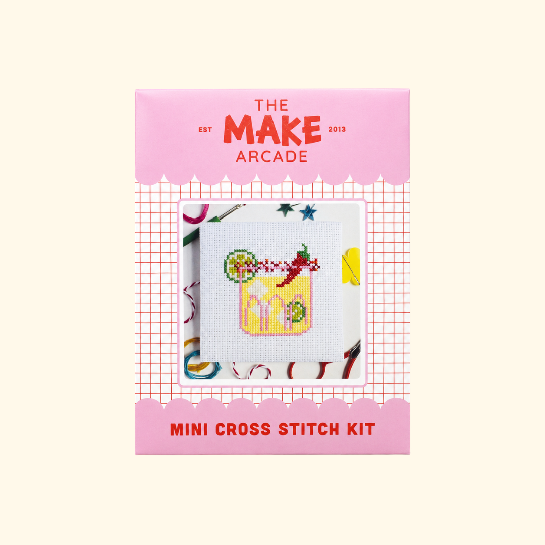 The Make Arcade Spicy Marg Mini Cross Stitch Kit in pink recyclable packaging.