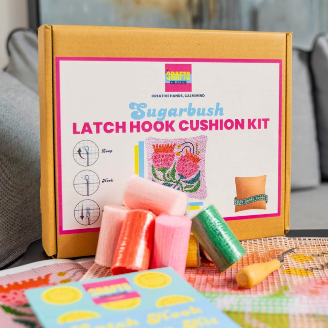 Sugarbush Latch Hook Cushion Kit contents including yarn, printed canvas, latch hook tool and instructions.