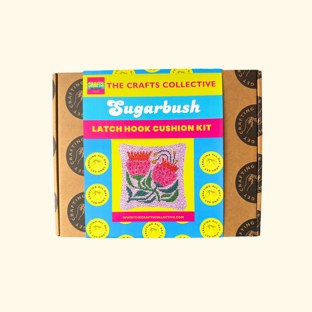 Sugarbush Latch Hook Cushion Kit by The Crafts Collective in colourful gift box packaging.