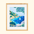 Sugiton Cove Pastels By Numbers Kit by La Petite Epicerie featuring a colourful Mediterranean coastal landscape with turquoise waters, rocky cliffs and lush greenery, displayed in a natural timber frame.