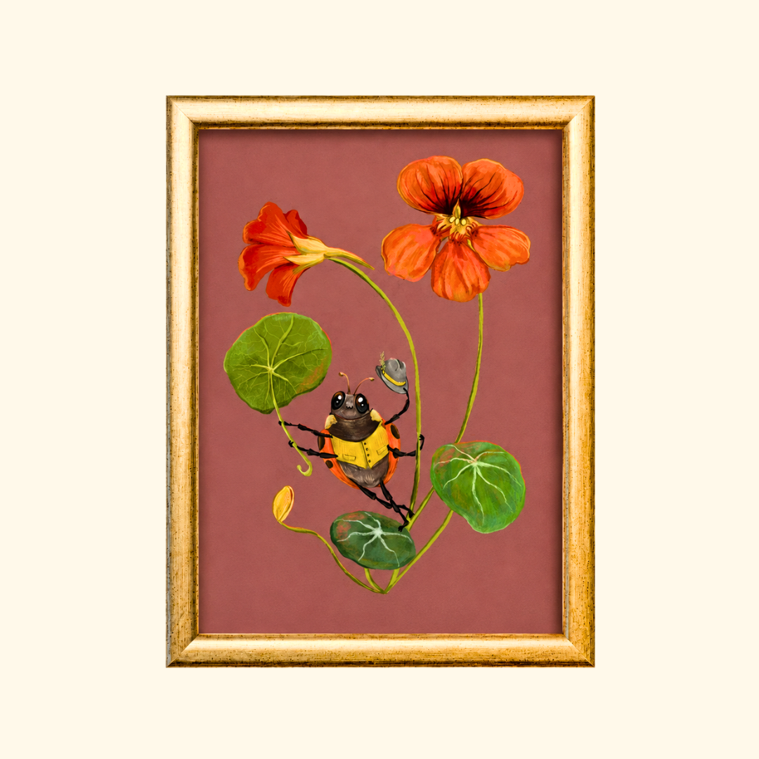 Sun Shower greeting card displayed in a gold frame, showcasing the vibrant botanical illustration of a bee and nasturtium flowers.
