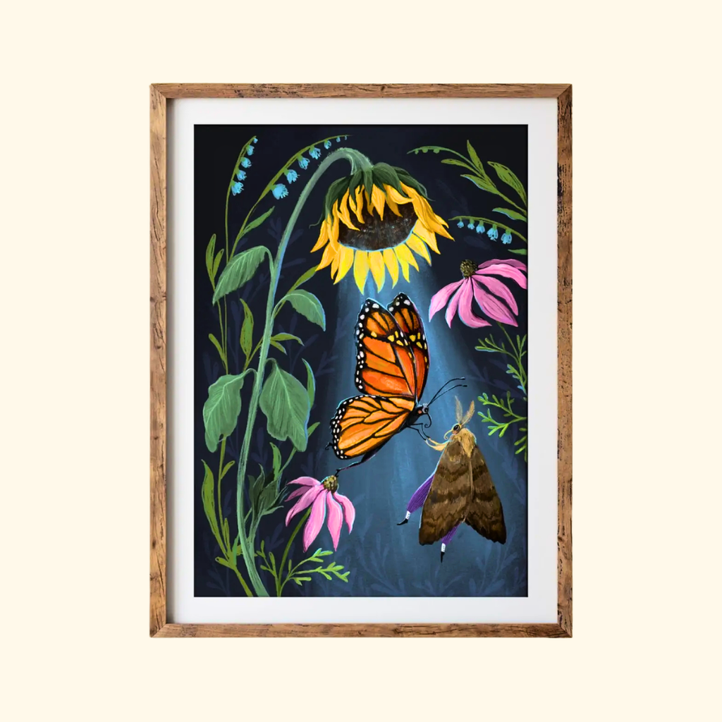 Sunflower Dancers A4 art print by Anna Seed Art displayed in a timber frame, featuring butterflies, moths, sunflowers and colourful botanical details.